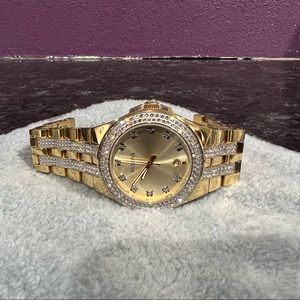 Bulova watch diamond out gold